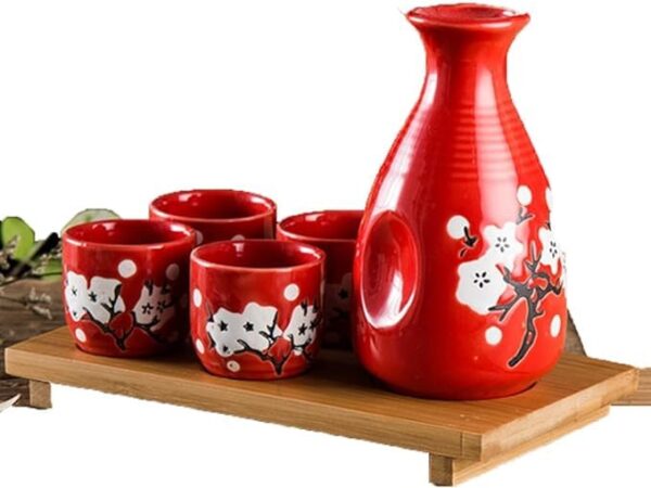 LS LUXURIOUS Red & White floral Japanese Porcelain Sake Set with 4 Cups 1 Decanter / Bottle / Carafe Material: Porcelain Colour: Red & White Size: Cup is 2"x 1 3/4" , Bottle is 5"x2" Packing of: "5Pcs