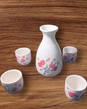 LS LUXURIOUS Cream & Red floral Japanese Porcelain Sake Set with 4 Cups 1 Decanter / Bottle / Carafe Material: Porcelain Colour: Black & Grey Size: Cup is 2"x 1 3/4" , Bottle is 5"x2" Packing of: "5Pcs